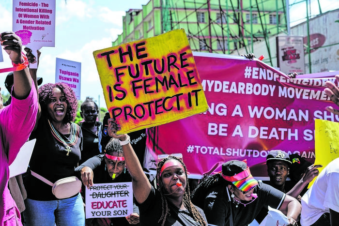 Protesters Hold Placards Expressing Their Opinion During The