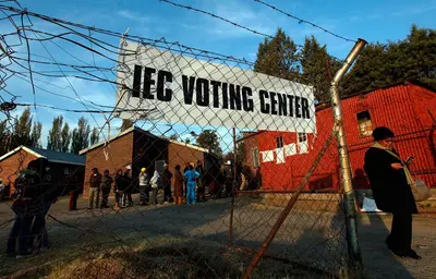 Voters queue at a voting station in Maseru
